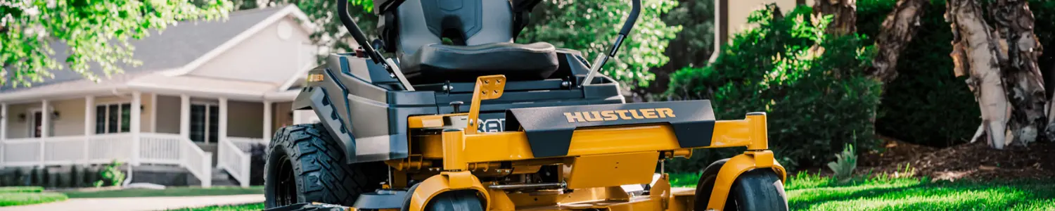 Banner featuring a yellow Hustler zero-turn mower on a residential lawn
