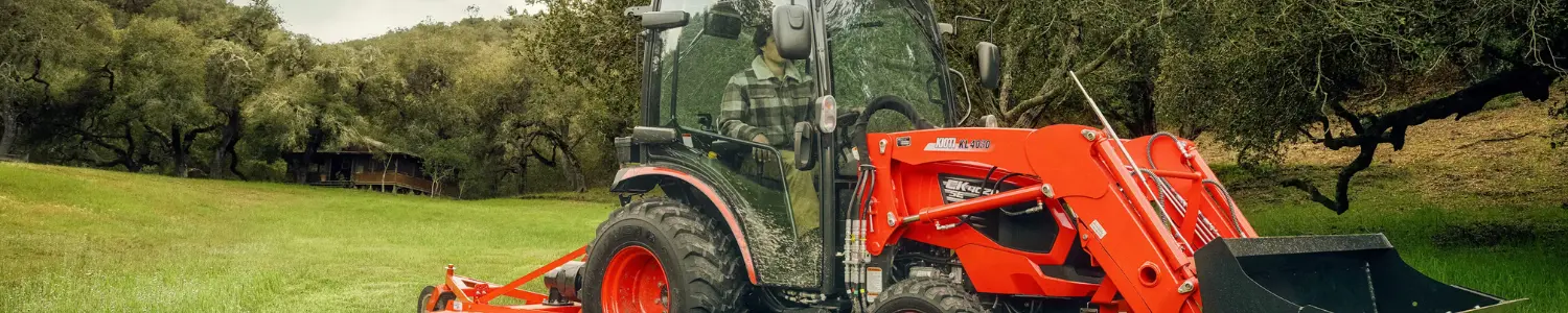 Banner featuring a red Kioti utility tractor in a field