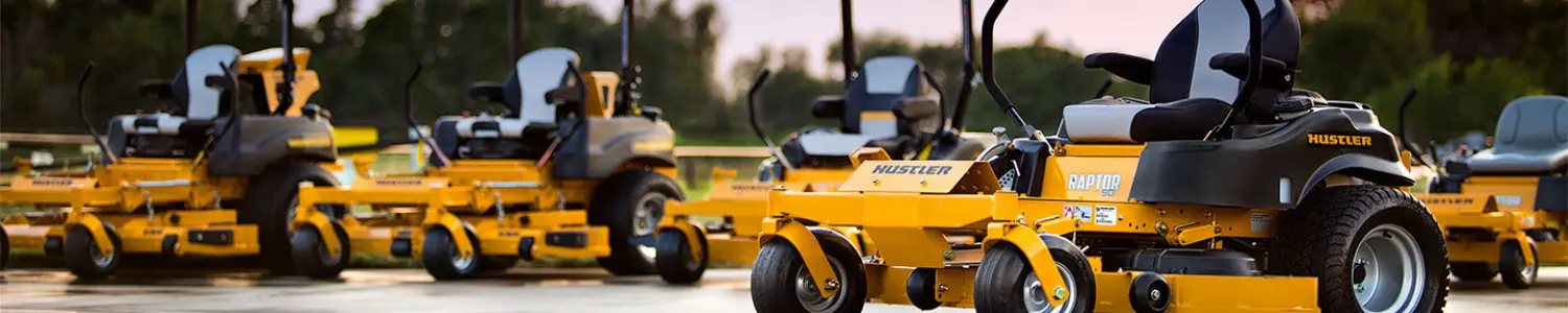Banner featuring a lineup of yellow Hustler zero-turn lawn mowers